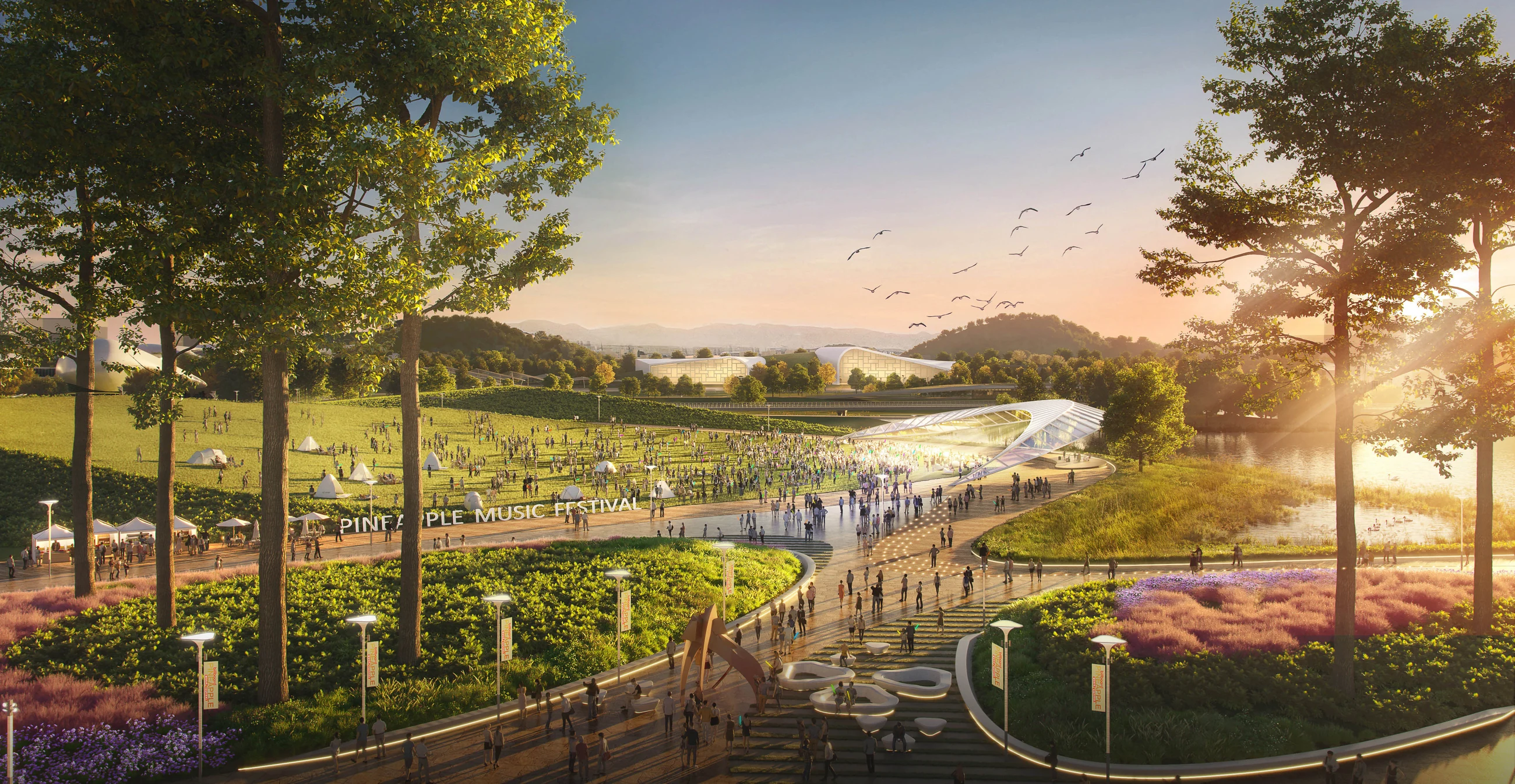 Sunset view of a broad landscaped promenade and water gardens